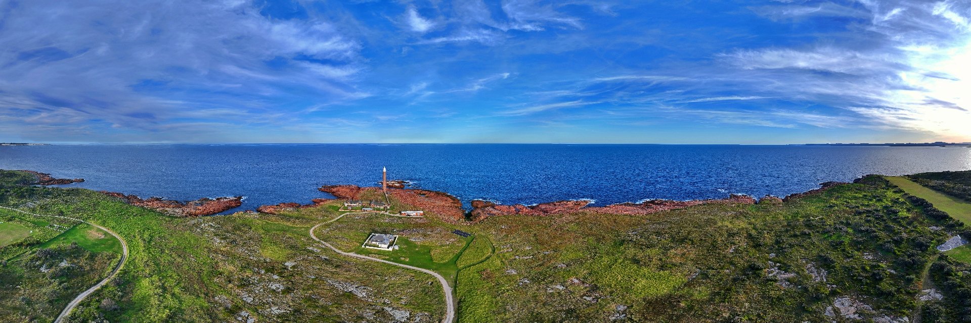 Gabo Island lighthouse station headland with keepers cottages and sea